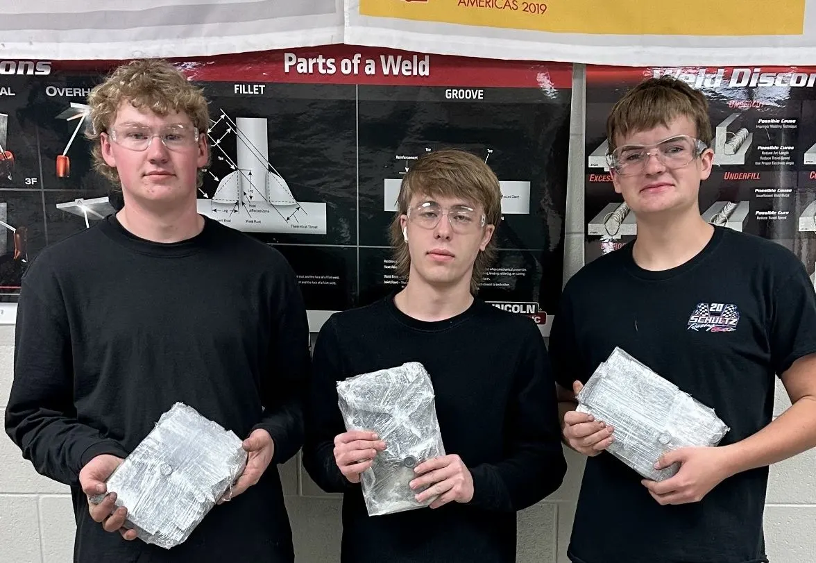 student welders in a group photo